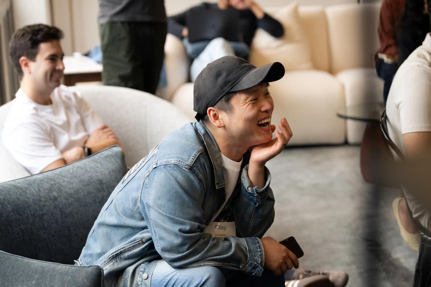 Distyl team members sharing a conversation at a company gathering